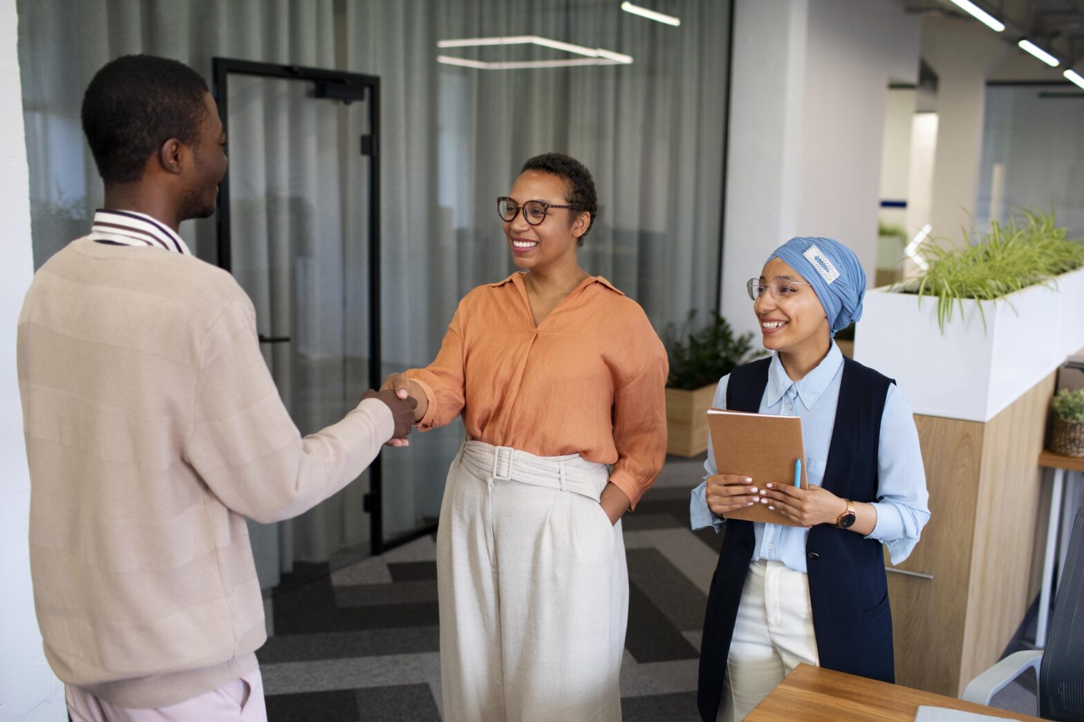 A professional team collaborating in a modern office, symbolizing effective employee retention strategies for entrepreneurial success.